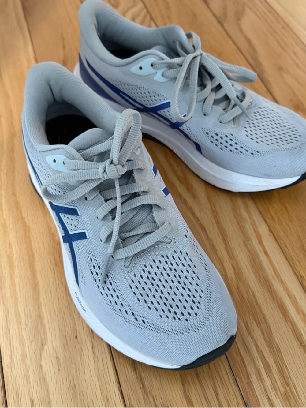 ASICS women’s gt 1000 12 Running Shoe - Light Gray with Blue Accents
